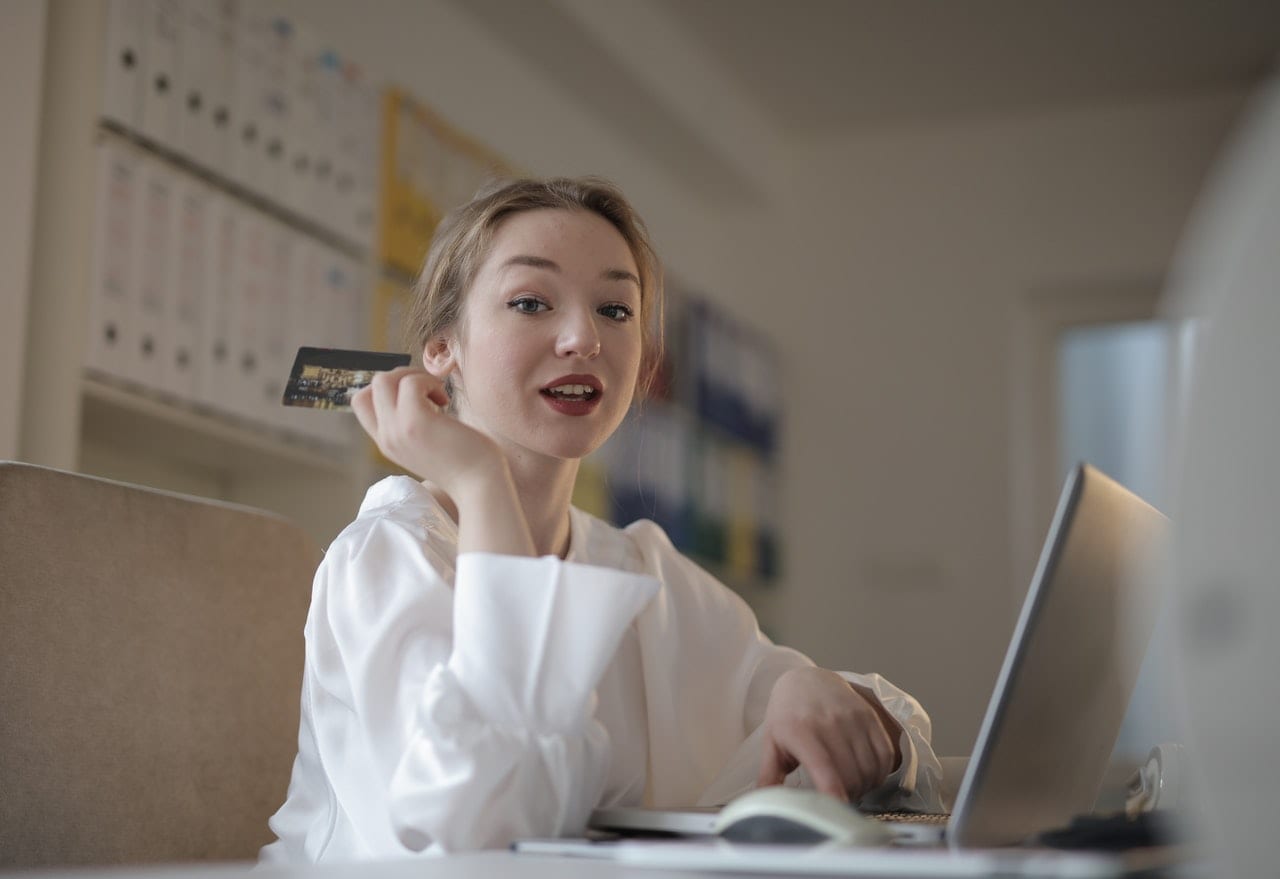pexels-andrea-piacquadio-3770140 Young woman with credit card paying online